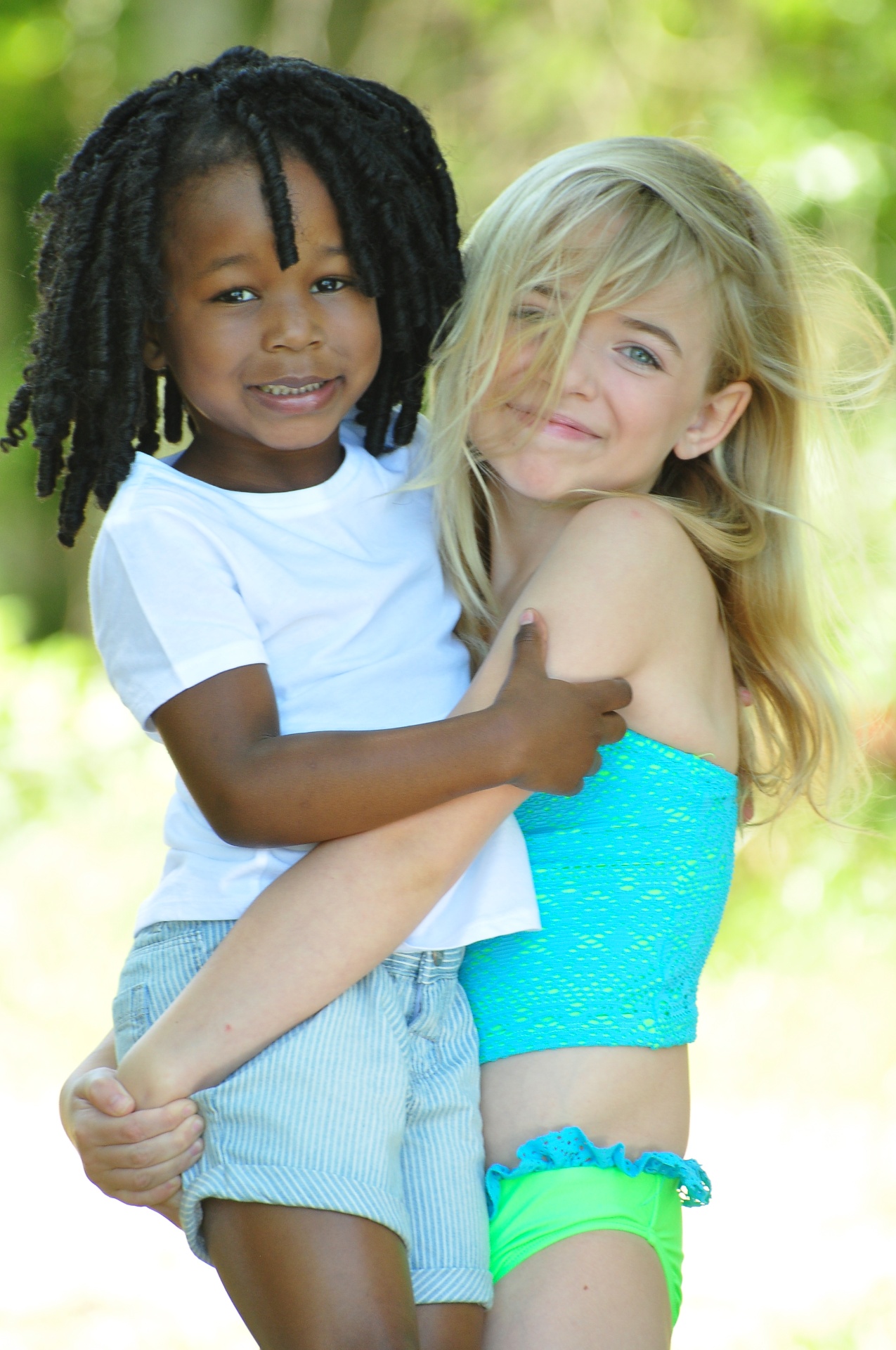 Two children photographed outdoors in natural light