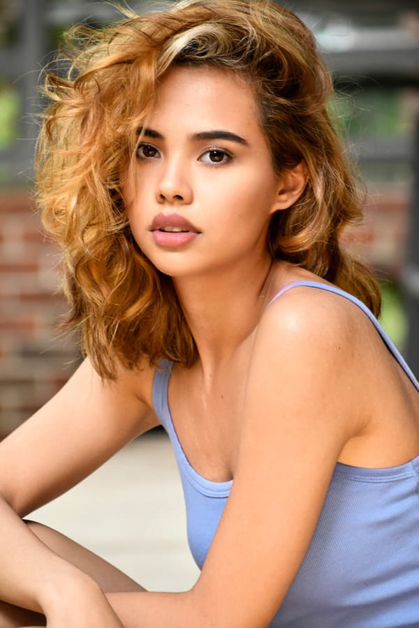Young actress headshot with curly hair in blue tank, NYC by Dorothy Shi
