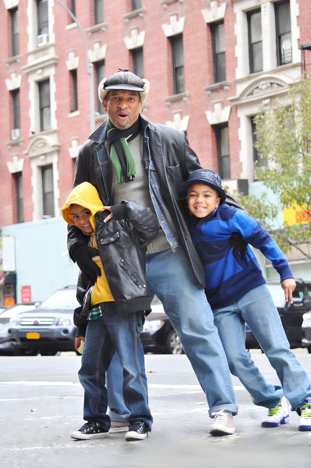 Commercial family lifestyle — dad with two kids on NYC street