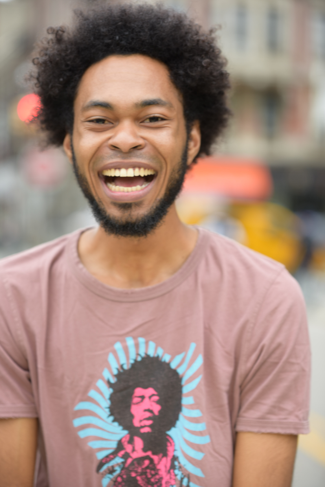 Male actor laughing outdoor street headshot, NYC by Dorothy Shi