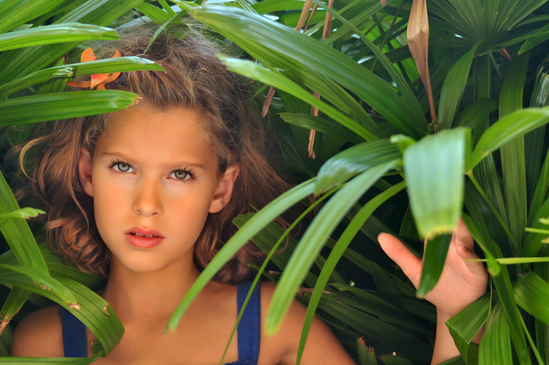 Young girl portrait in tropical palms — NYC children's photographer Dorothy Shi