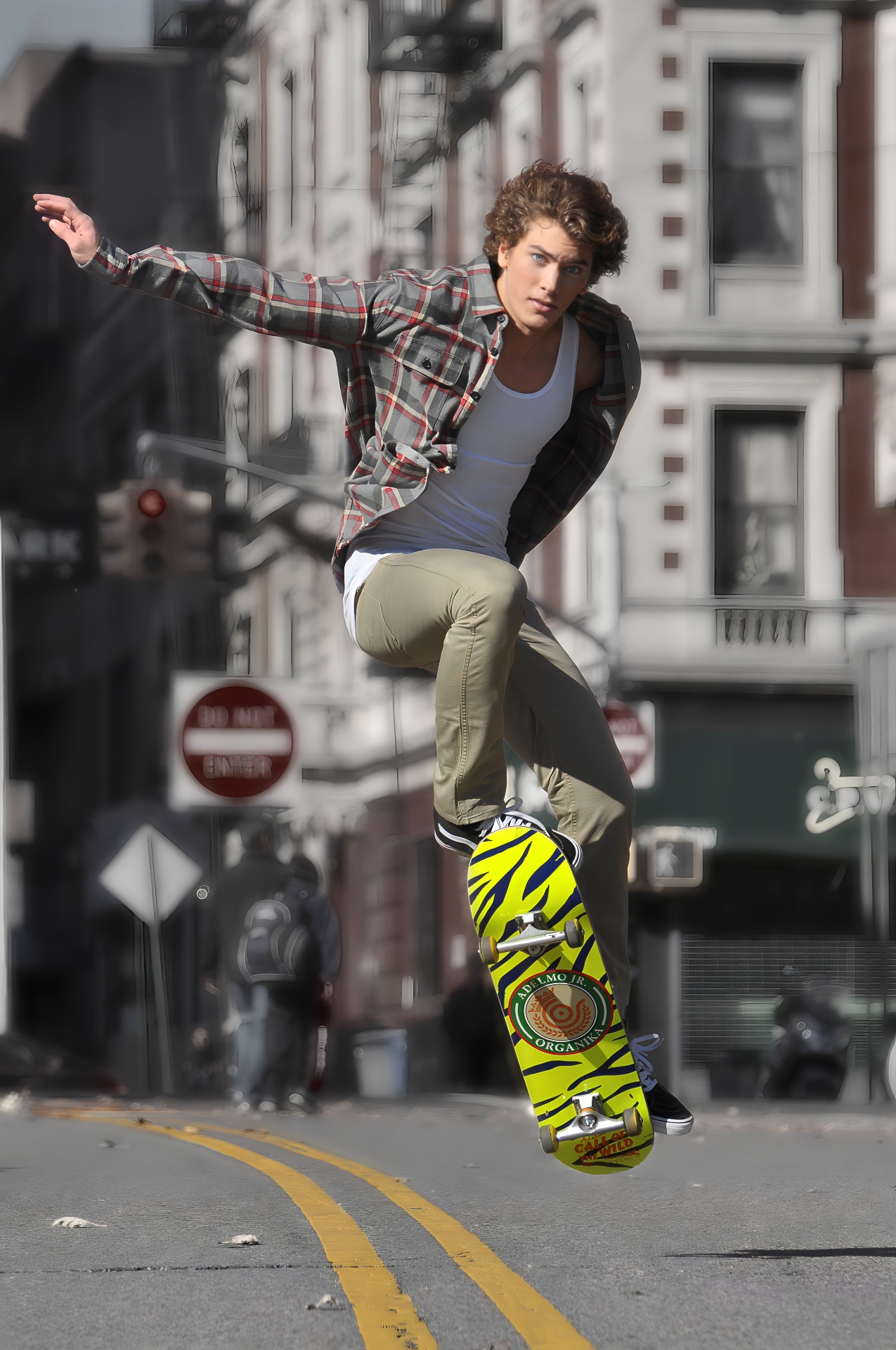 Commercial youth lifestyle — skateboarder mid-air on NYC street