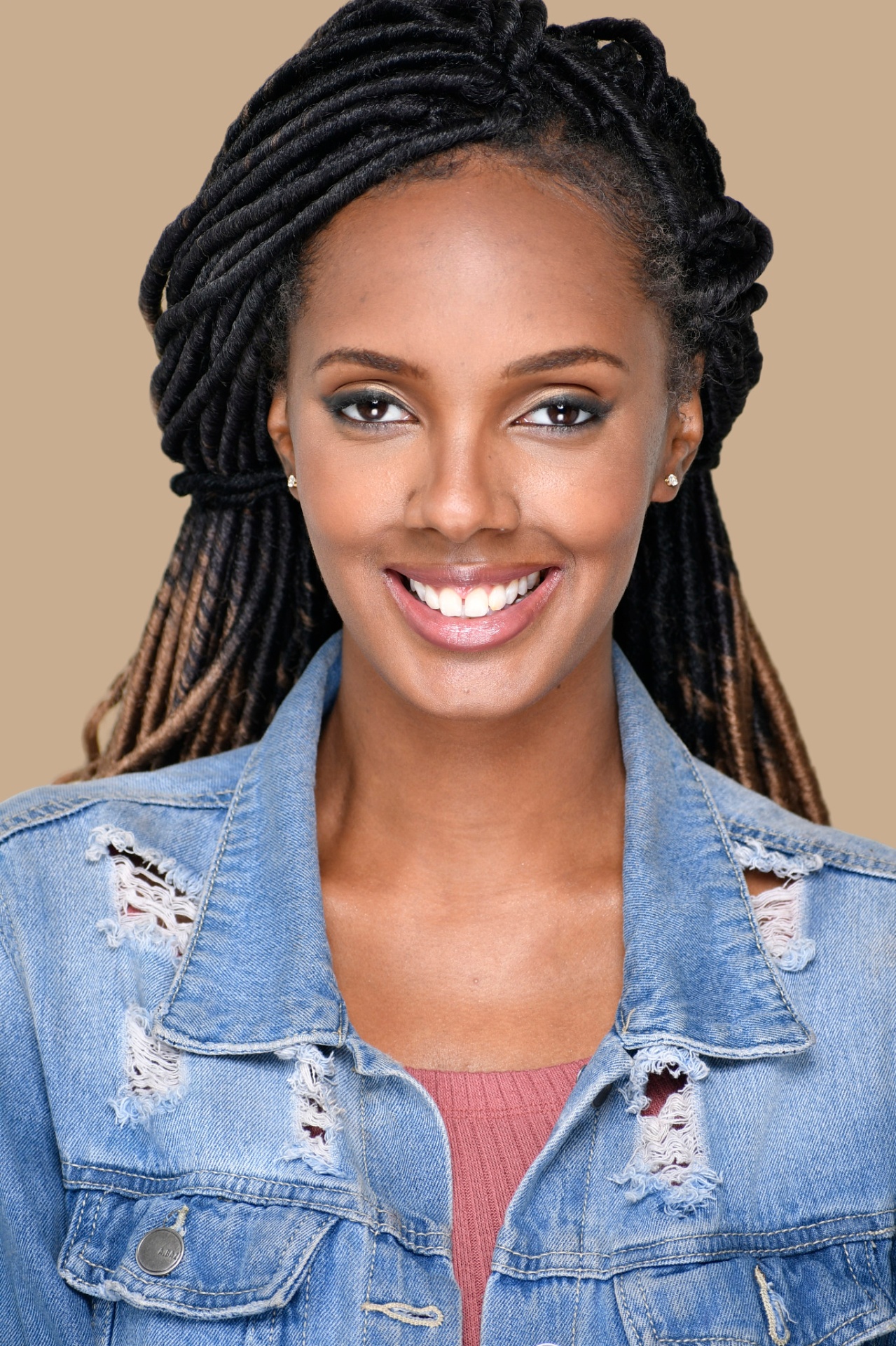 Professional actor headshot — actress with locs in denim jacket, NYC