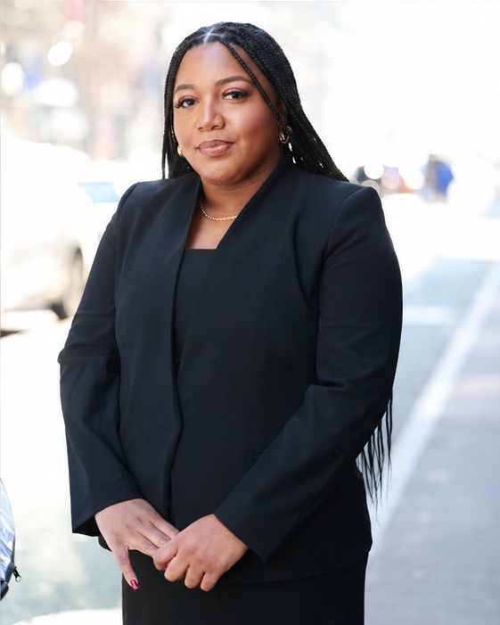 On-location NYC headshot of a woman in a black blazer