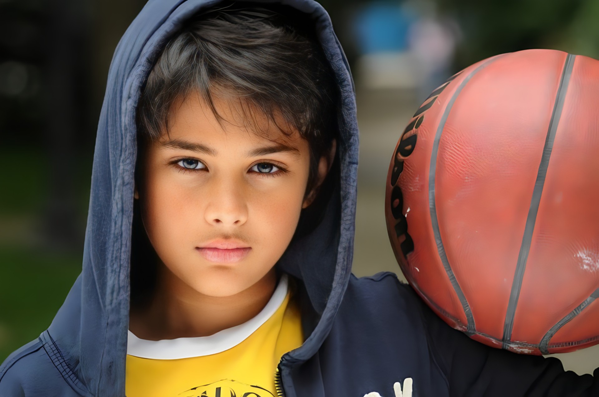 Boy with basketball and hoodie — NYC child model headshot