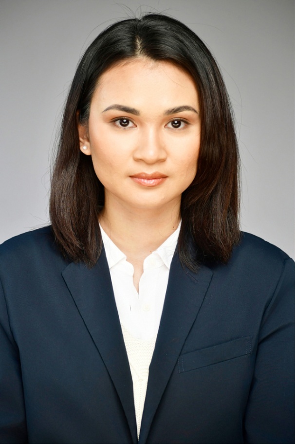 Executive headshot of a woman in a navy blazer, NYC